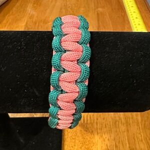 Pink and Green Handmade Braided Nylon Bracelet. Snap clasp closure.